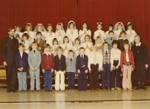 My 8th grade class photo. Can you spot me in there?